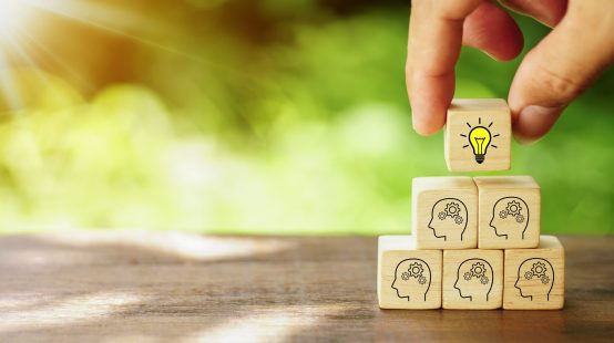 brainstorming-creative-idea-innovative-idea-concept-hand-picked-wooden-cube-block