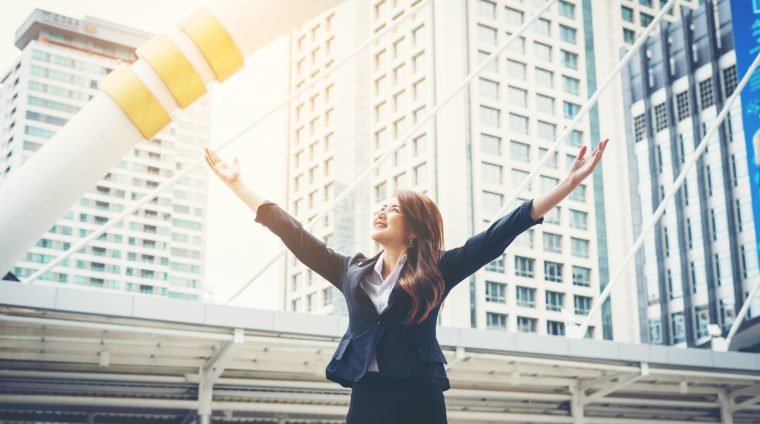 happy-businesswoman-exults-pumping-fists-ecstatic-celebrates-success-outdoor