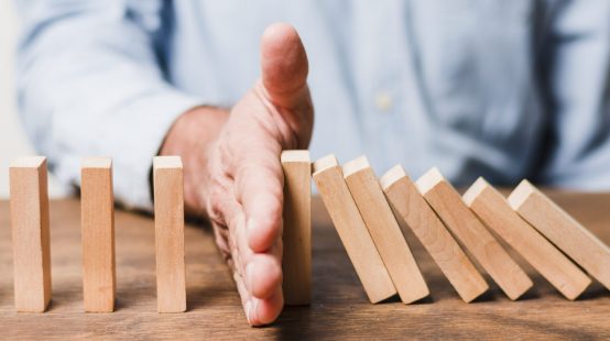 businessman-using-wooden-pieces