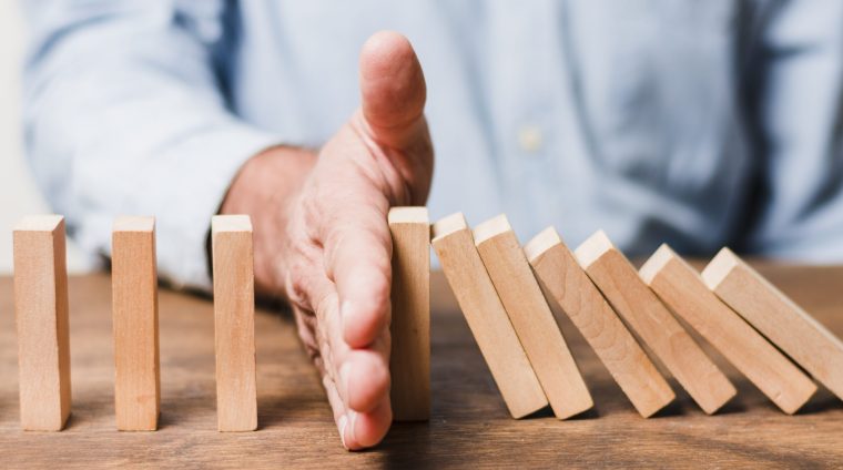 businessman-using-wooden-pieces