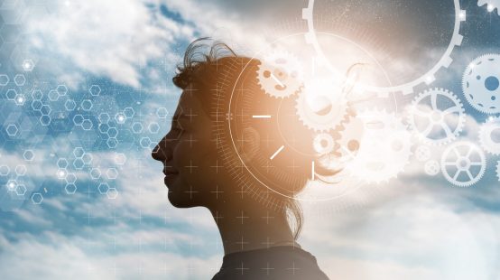 CG of female profile silhouette, gears, and blue sky