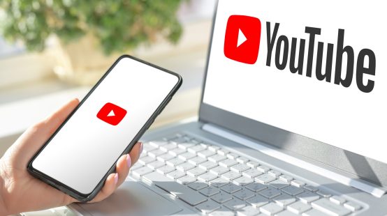 Moscow, Russia - August 17, 2021 : Youtube is most popular video service developed by Google. Woman hand hold phone with networking service Youtube on screen cellphone .