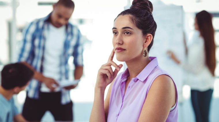 Young creative worker thinking in casual office
